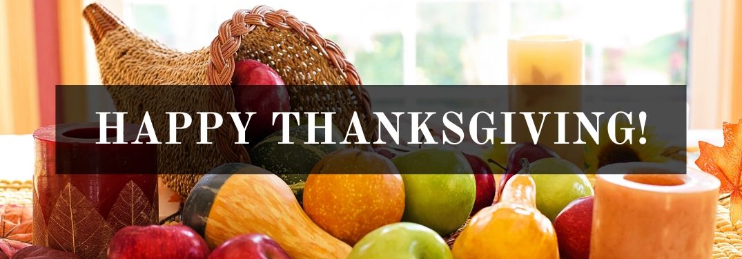 Thanksgiving Cornucopia with Fruits and Vegetables on a Table with Black Text Box and White Happy Thanksgiving! Text