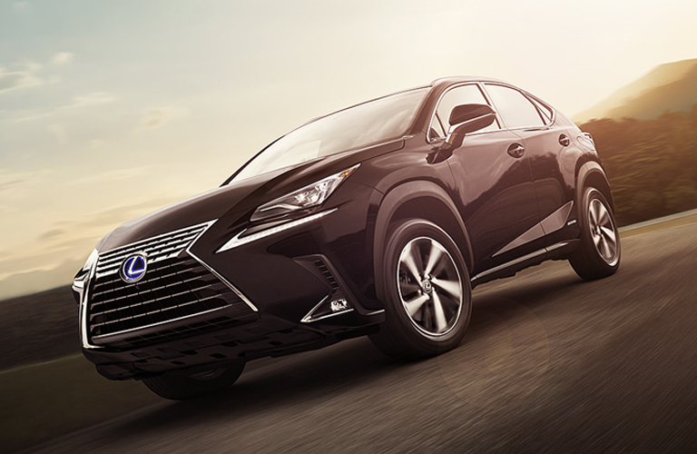 Black 2020 Lexus NX Hybrid on Country Road at Sunset