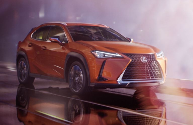 Orange 2020 Lexus UX Hybrid on City Street