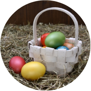 White Easter Basket with Colorful Easter Eggs
