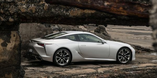 Silver 2021 Lexus LC Coupe Rear Exterior on Dark Rock Background