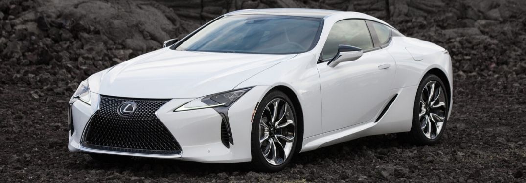 White 2021 Lexus LC Coupe Front Exterior on Dark Rock Background