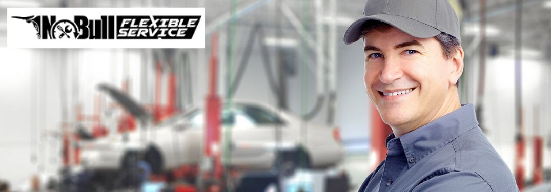 Young Mechanic in a Garage with Black No Bull Flexible Service Logo in Upper Right Corner