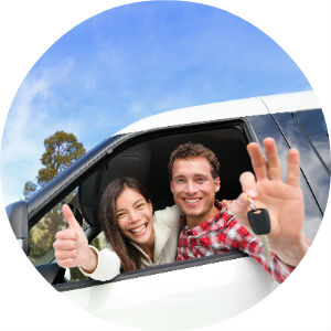Happy Couple Holding Keys in New Car