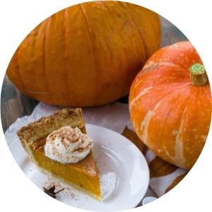 Pumpkins and Pumpkin Pie on a Table