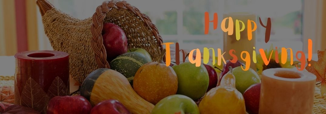 Thanksgiving Cornucopia with Food and Fall-Colored Happy Thanksgiving Text