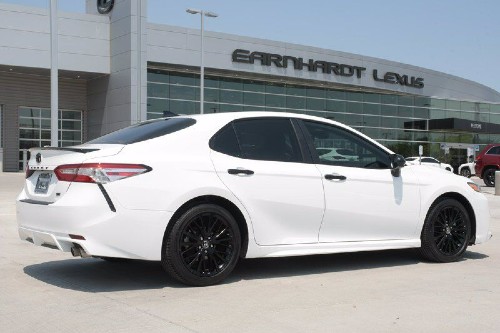 A rear 3/4 view of a 2020 Toyota Camry SE Nightshade edition.