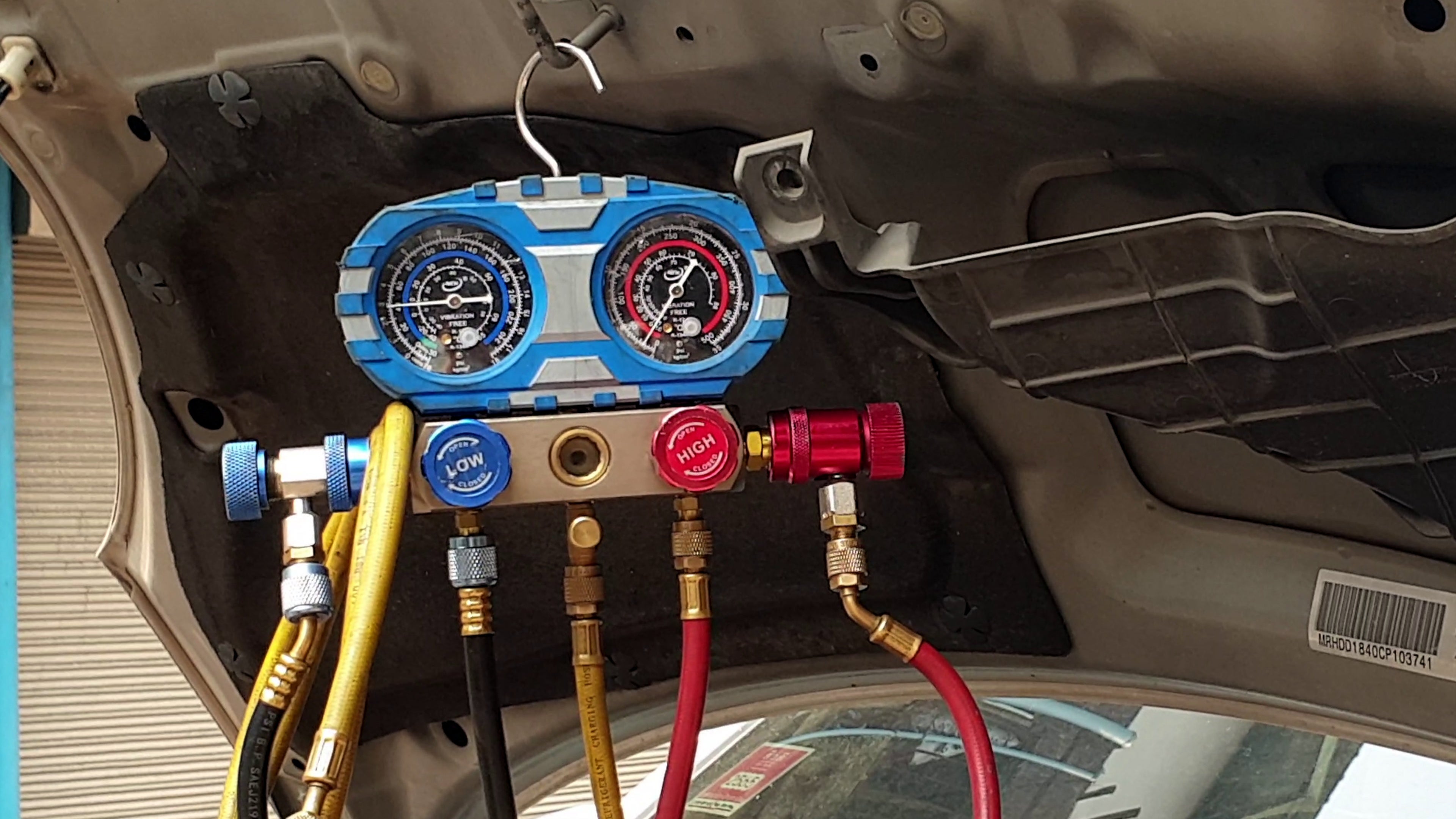Repair garage checking for air ac compressor cooling system leaking suspect car auto.